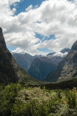 Fototapeta premium landscape with sky, clouds and a backdrop of snowy peaks, New Zealand