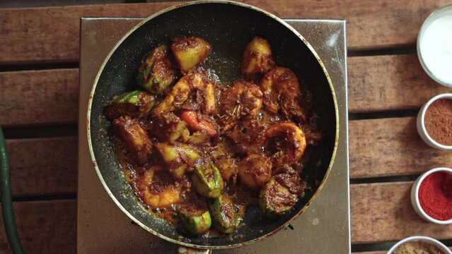 cooking pointed ground or potol or parwal shrimp curry with potato