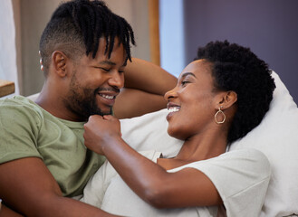 African couple, love and smile in bedroom for commitment, marriage and together for relax in morning. Man, woman and happy in apartment for conversation, partner and romance for bonding or support