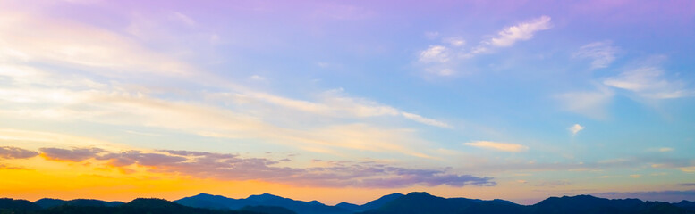 Sunset Sky over the mountain as Twilight in the Evening as the colors of Sunset Horizon scene