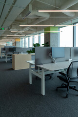 Interior of modern empty office building.Open ceiling design.Equipped with automatic lifting table and LCD screen.