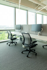 Interior of modern empty office building.Open ceiling design.Equipped with automatic lifting table and LCD screen.