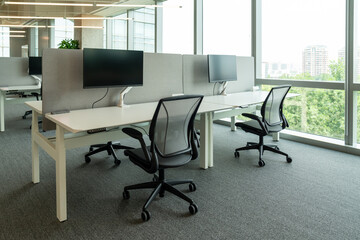 Interior of modern empty office building.Open ceiling design.Equipped with automatic lifting table and LCD screen.
