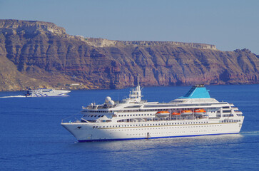 Dream holiday vacation to Greek Island Santorini during Summer Mediterranean Aegean cruising on Celestyal breathtaking nature landscape scenery