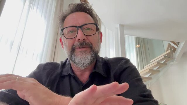 Confident smiling professional man webinar speaker coach entrepreneur teacher talking looking at camera webcam record video training vlog make online business conference call, webcamera cam view