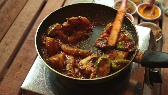 cooking pointed ground or potol or parwal shrimp curry with potato