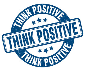 Fototapeta premium think positive stamp. think positive label. round grunge sign