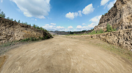 Open-pit mining sounds like a giant sandbox for adults, doesn't it? Imagine huge machines that look like oversized toy excavators