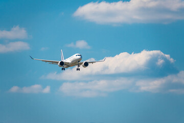 plane landing against a background of clouds