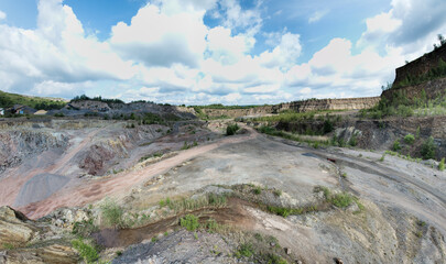 Obraz premium Open-pit mining sounds like a giant sandbox for adults, doesn't it? Imagine huge machines that look like oversized toy excavators