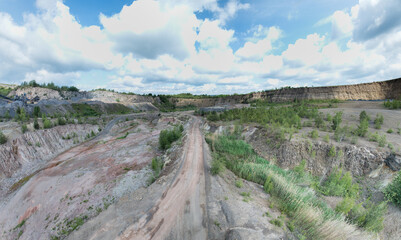 Open-pit mining sounds like a giant sandbox for adults, doesn't it? Imagine huge machines that look like oversized toy excavators