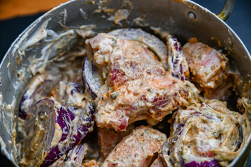 Meat marinating for the shashlik (or shish kebab) in mayonnaise, with onion