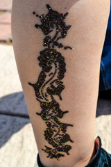 Henna tattoo on the leg