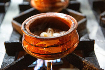 Meat in pot, close up. Tasty street food in Pakistan. 