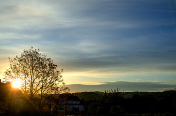 Fototapeta na wymiar Early morning sky in Germany with clouds in the background