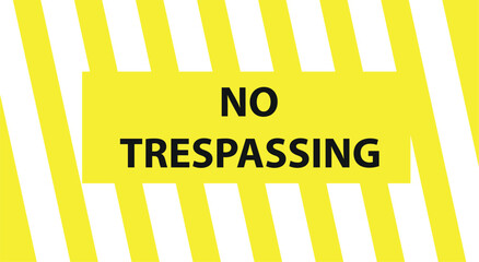 No trespassing sing hanged on an wire fence in front of a dockyard. It says that passing from here is forbidden.