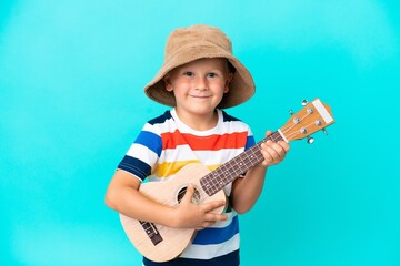 Little Russian boy with guitar over isolated background