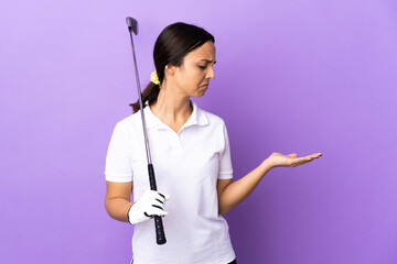 Young golfer woman over isolated colorful background holding copyspace with doubts
