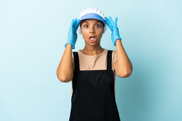 Fishwife asian woman over isolated background with surprise expression