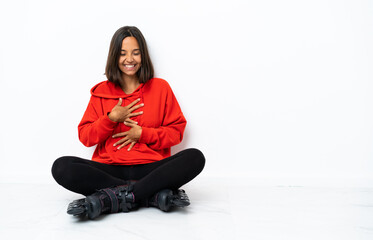 Young asian woman with roller skates on the floor smiling a lot