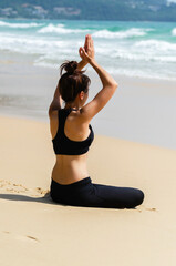 Yoga Meditation woman on the ocean during amazing sunset. Fitness and healthy lifestyle.
