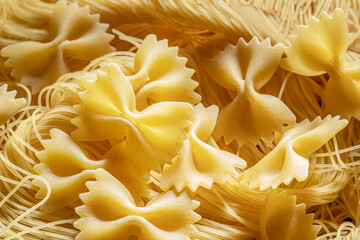 Italian pasta farfalle and vermicelli close-up. Food background.