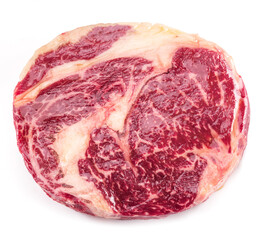 Raw ribeye steak isolated on white background.