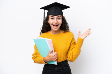 Arab university graduate woman holding books isolated on white background with shocked facial...