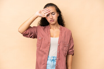 Young woman isolated on beige background with tired and sick expression