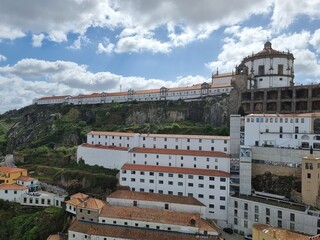 Obraz premium Porto, Portugal, typical architecture in the city center with white houses and red roofs, green nature near the buildings