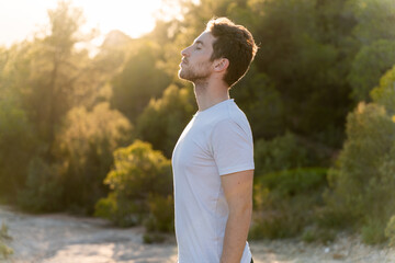 Attractive man breathing outdoors