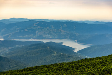 Fototapeta premium Aerial view of mountains from summit in Izvorul Muntelui Lake