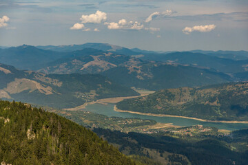 Fototapeta premium Aerial view of mountains from summit in Izvorul Muntelui Lake
