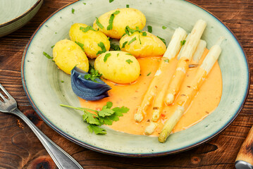 Boiled new potatoes with asparagus.
