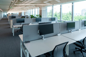 Interior of modern empty office building.Open ceiling design.Equipped with automatic lifting table and LCD screen.