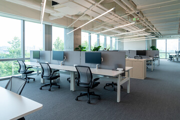 Interior of modern empty office building.Open ceiling design.Equipped with automatic lifting table and LCD screen.