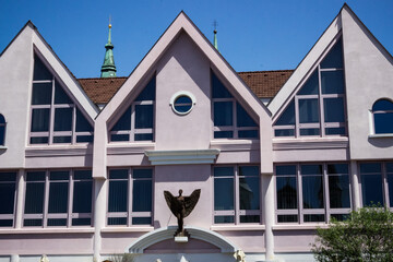 the roof of a house with turret decorations, decorative elements, windows, architecture of a small town © Наталія Богодіца