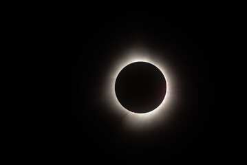 Total solar eclipse with a bright light eclipse in a dark space