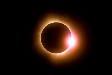 Solar eclipse featuring a diamond ring effect and baileys beads