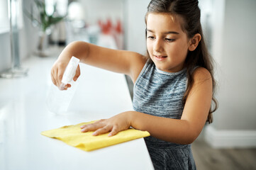 Cloth, spray and child cleaning table in home for hygiene, chores or housekeeping maintenance....