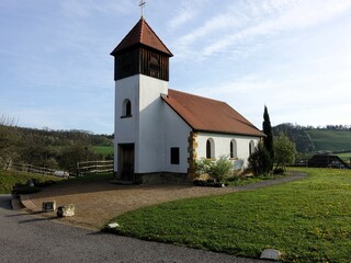 the old chapel at the foot of a hill in germany