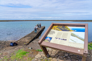 Pontoon in Fajãs de Santo Cristo on the trail entering the lagoon with tourists. São Jorge...
