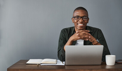 Happy black man, laptop and portrait in office for software, research and work on wall background...