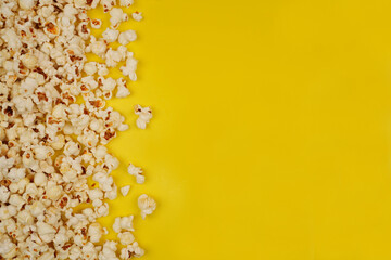 butter popcorn shaping border against yellow background concept