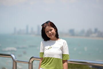Smiling woman enjoying a sunny day at the beach