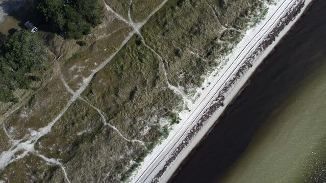 Aerial shot of the coastal buildings and the sandy shoreline of Kattegat Strait in Varberg, Sweden