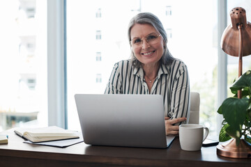 Mature woman, portrait and laptop for planning at desk, communication and site for ideas research....