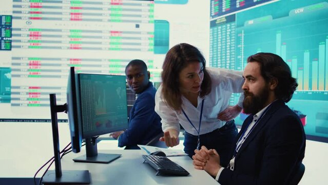 Irritated angry team leader screaming at her coworker after he failed to calculate expenditures, showing her disappointment in front of everyone. Furious dissatisfied business manager. Camera B.