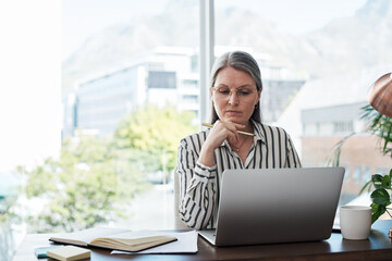 Mature woman, thinking and laptop for proposal in office, brainstorming and site for ideas...