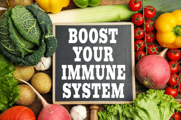 Boost your immune system with proper diet. Different foods and small chalkboard, flat lay